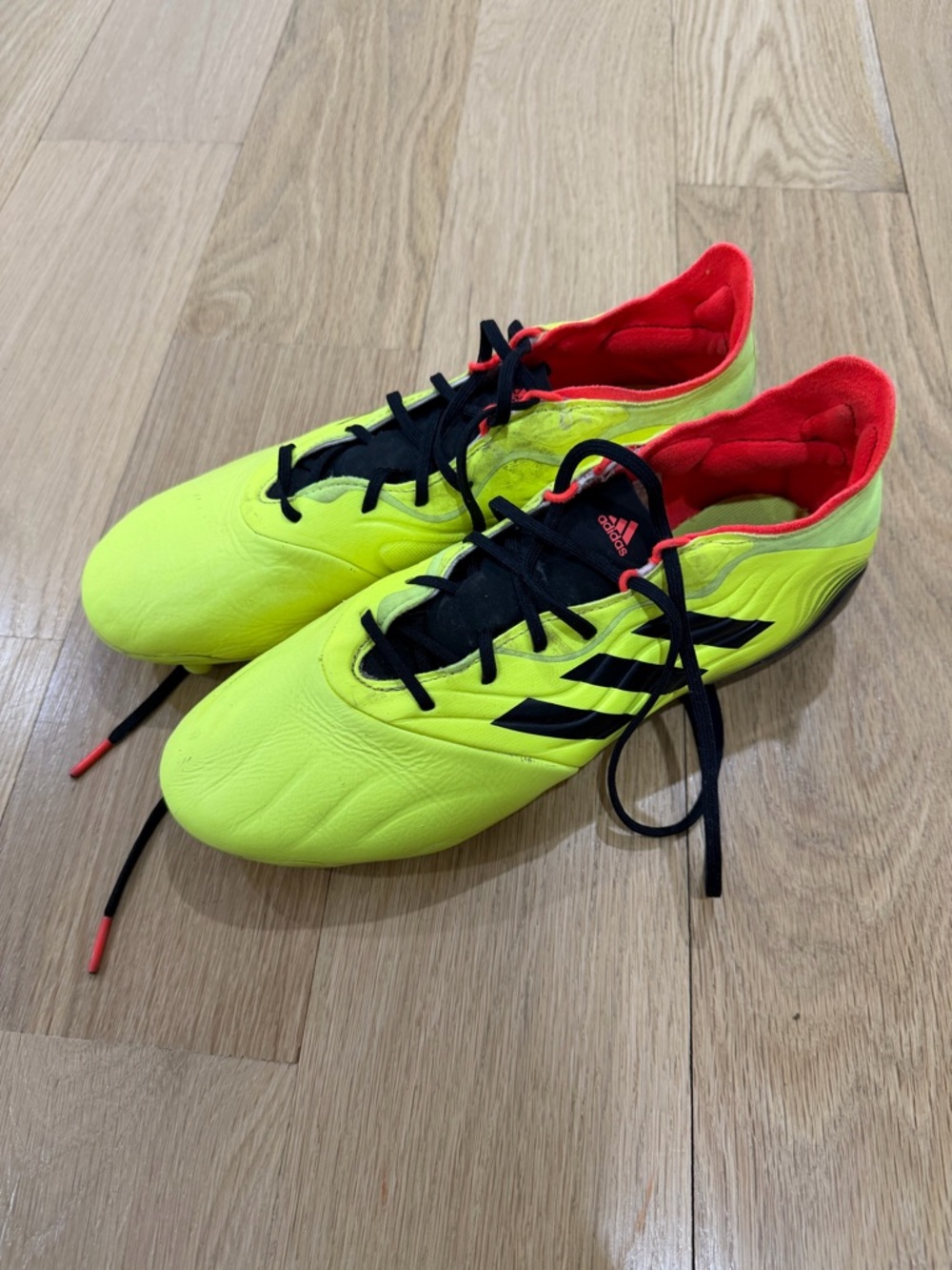 Adidas Neon Yellow and Black Soccer Cleats with Red Lining